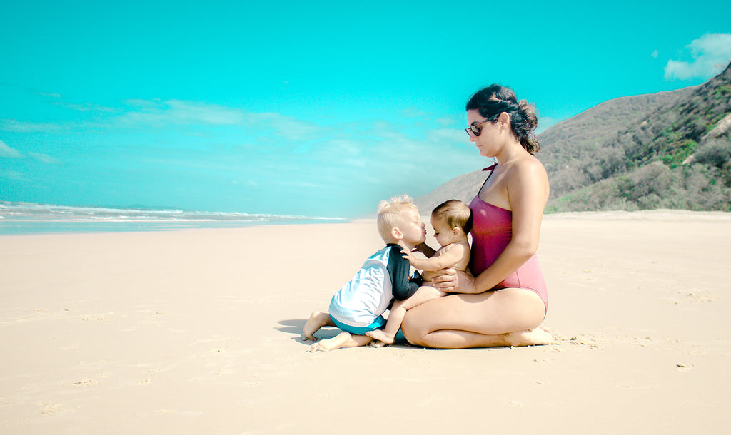 Sugar Sugar Wax Founder traveling with family on the beach