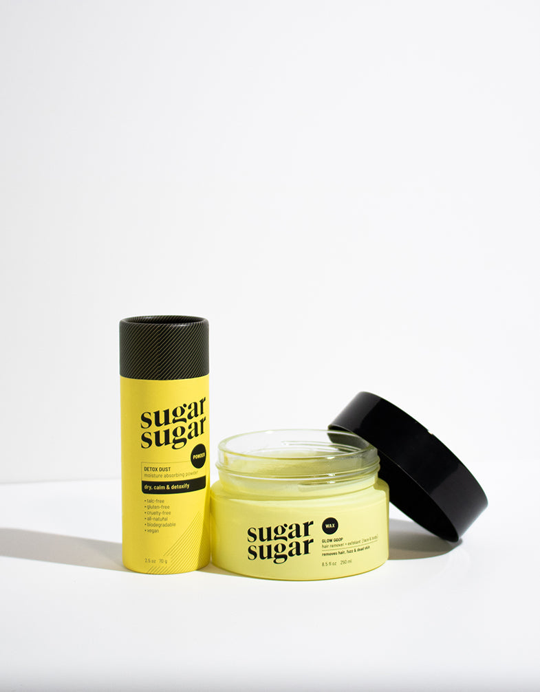 Sugar Sugar Wax Glow Goop and Detox Dust products. Bare Body Essentials kit from Sugar Sugar Wax. Glow Goop jar with open lid.
