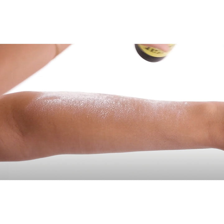 Applying body powder to arm. Sugar Sugar Wax Detox Dust application on arm.